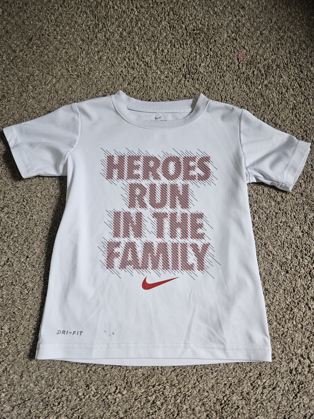 Nike White Kids Tee with Red Graphic 'Heroes Run in the Family' Size 4-5yrs